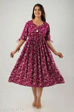 Printed cotton rayon woman's long anarkali kurta with 3/4 sleeves, tassels on sleeves, hand-worked round neck. Not affected by washing