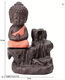 Handcrafted monk orange poly resin Buddha incense holder with backflow cone and 10 incense cones. Artistic waterfall smoke effect perfect for home decor