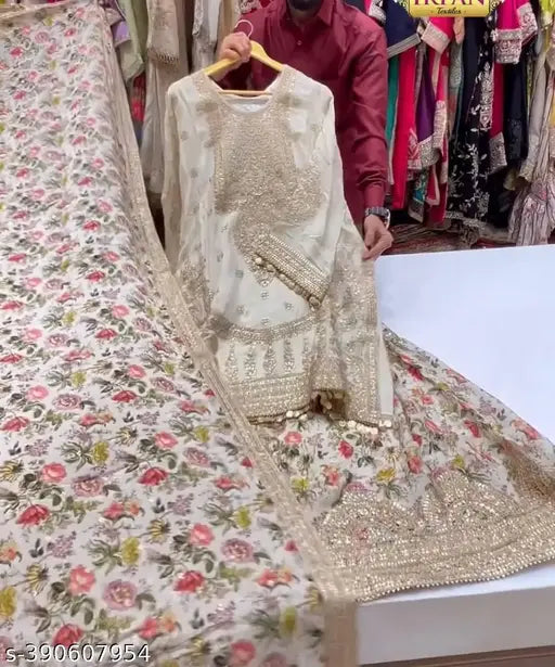 Heavy faux Georgette Sharara suit set, printed with new designer motifs. Three-quarter sleeve kurta with dupatta and bottomwear. Indian free size (waist 42in, length 40in)
