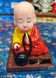 Contemporary solar-powered moving head Buddha statue, handcrafted in India