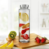 Transparent food-grade glass travel water bottle, 750ml capacity, leak-proof silver cap. Ideal for smoothies, juices, and fridge storage. Durable, shatter-resistant design, dishwasher safe, BPA-free. Perfect for active, health-conscious individuals. Made in India