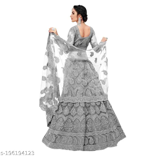 Embroidered net lehenga-choli with zari work (semi-stitched), free size. Indian bridal wear showcased on a mannequin