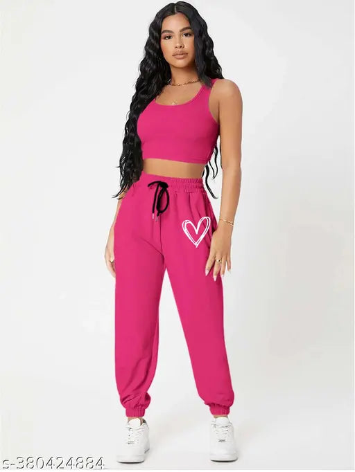 Pink cotton blend jogger pants with placement print, elevating casual athletic style from India