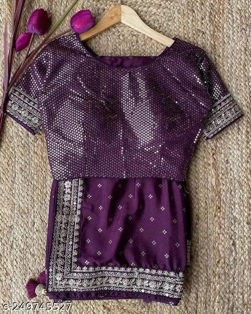 Wine-colored vichitra silk saree with stitched satin blouse, embellished net pattern, ready for Indian wedding wear or parties