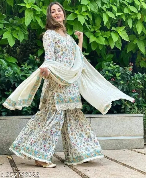 Rayon printed short kurti sharara set with dupatta and bottomwear, Indian women's fashion wear in three-quarter sleeves, vibrant pattern on rayon fabric