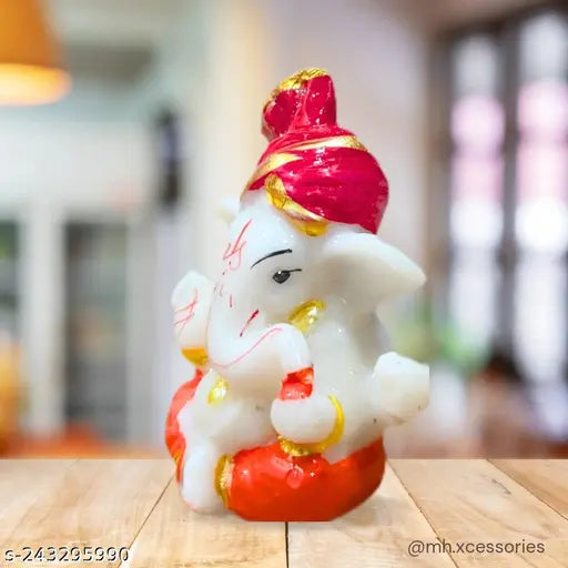 Handpainted resin Ganesh Idol for home decor or car dashboard, 10cm height x 1.5cm length and breadth