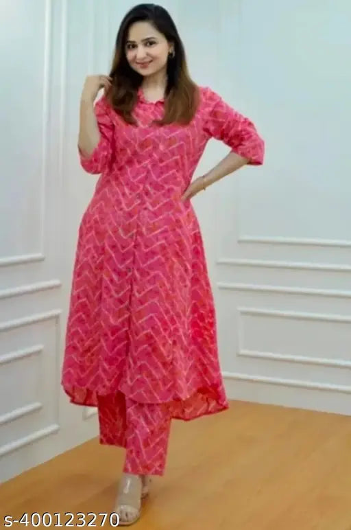 Pink rayon kurta set with printed net pattern, three-quarter sleeves, and pants. Perfect for formal and semi-formal occasions, exudes grace and charm." (125 characters)