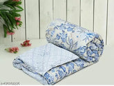 Multicolored, lightweight cotton single bed comforter (60x88 inches), ideal for mild winter and travel. Made in India