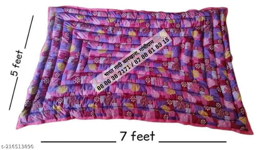 Multi-colored reversible cotton floral quilt, ideal for heavy winter use. Lightweight, warm, and breathable organic cotton filling. Soft and suitable for both summer and winter seasons. Made in India." (123 characters)