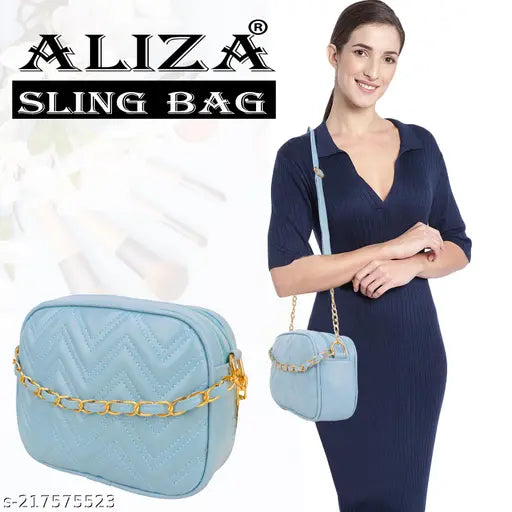 Blue faux leather slingbag, trendy travel cloud shape, 2 compartments, spacious, soft touch, fringe tassels, drawstring design, quality craftsmanship, Indian origin