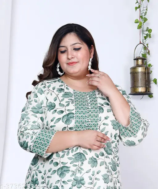 Green and white floral print plus size cotton straight kurta for women, three-quarter sleeves on a model