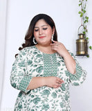 Green and white floral print plus size cotton straight kurta for women, three-quarter sleeves on a model