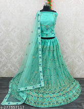 Aqua blue net Lehenga Choli with embroidered patterns, perfect for traditional occasions. High-quality fabric, free size." (120 characters)
