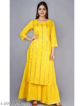 Yellow rayon kurta sharara with embellished net and three-quarter sleeves, best quality hand mirror work. Perfect for festivals, parties, office, or daily wear. Made in India