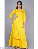 Yellow rayon kurta sharara with embellished net and three-quarter sleeves, best quality hand mirror work. Perfect for festivals, parties, office, or daily wear. Made in India