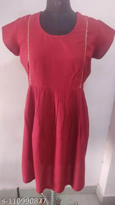 Maroon rayon flayered kurti, short sleeves, solid design. Gota lace detail on front and sleeves. Indian-made." (105 characters)