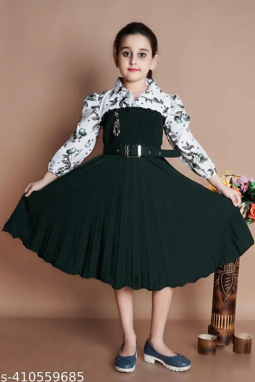 Green crepe party frock for girls with belt, features long sleeves and printed net pattern