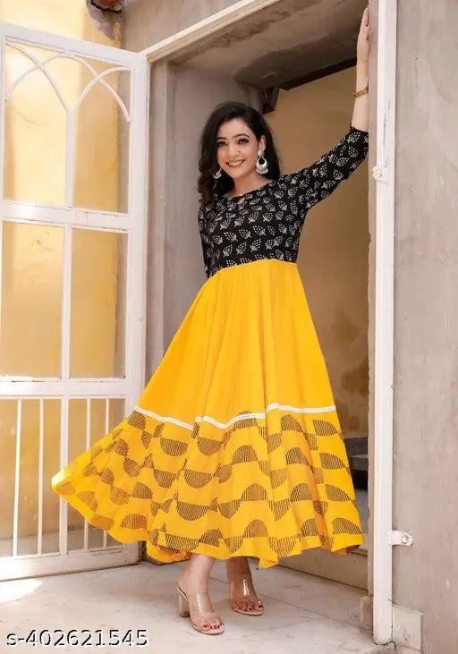 Yellow rayon flared kurti with three-quarter sleeves, printed combo. Close-up on single sized S, L (40in bust), XL, XXL (44in bust). Indian fashion apparel