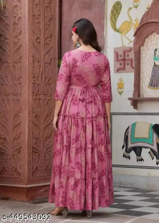 Pink rayon printed Anarkali kurti and gown, featuring three-quarter sleeves and a mesmerizing leaf design. Perfect for casual outings or festive gatherings. Machine washable." (125 characters)