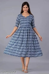 Geometric one-piece cotton dress, printed with geometric pattern. Three-quarter sleeve length. Available in sizes M, L, XL, XXL. Made in India