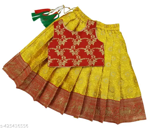 Art Silk baby girl Pattu Pavadai Lehenga Choli dress with woven design, sleeveless and stitched net. Available sizes: 6-12M (19x16in), 18-24M (23x20in), 1-2Y (23x20in), 2-3Y (24x21in), 3-4Y (25x22in), 4-5Y (26x24in), 5-6Y (27x25in), 6-7Y (28x30in), 7-8Y (28x31in). Made in India