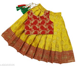 Art Silk baby girl Pattu Pavadai Lehenga Choli dress with woven design, sleeveless and stitched net. Available sizes: 6-12M (19x16in), 18-24M (23x20in), 1-2Y (23x20in), 2-3Y (24x21in), 3-4Y (25x22in), 4-5Y (26x24in), 5-6Y (27x25in), 6-7Y (28x30in), 7-8Y (28x31in). Made in India