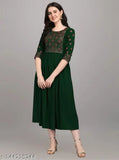Green rayon anarkali kurti with multicolor embroidery, three-quarter sleeves on display rack