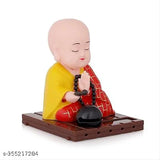 Multicolor solar-powered Buddha statue (9cm height), eco-friendly home decor, captivates with moving head and ringing drum in sunlight or room light