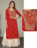 Red embroidered Rayon kurta with Sharara bottom, three-quarter sleeves, round neck. Indian printed net design
