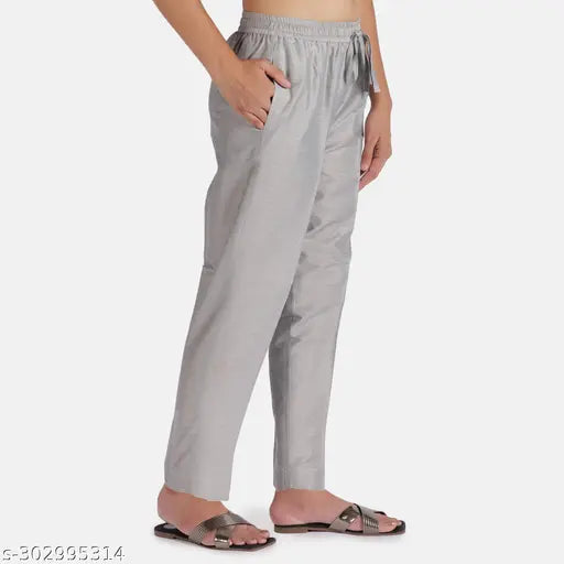 Silver poly blend solid net Women Kurti Pant with double pockets, full elastic waist, and both side pockets. Kurti pant manufactured in India