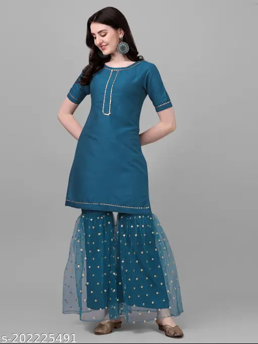 Teal silk blend kurta with sharara and dupatta, embroidered with sequins and lace for festive or traditional wear (Size: S-XXL)