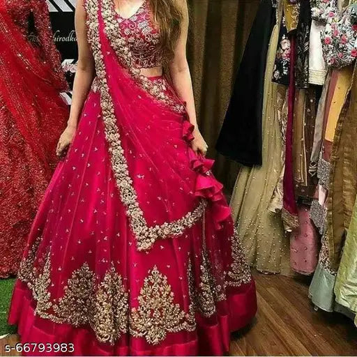 Pink embellished Dulhan Lehenga-Choli set with net fabric and semi-stitch embroidery, featuring a silk satin Choli and 2.5m dupatta. Traditional Indian bridal wear for festivals, parties, and weddings