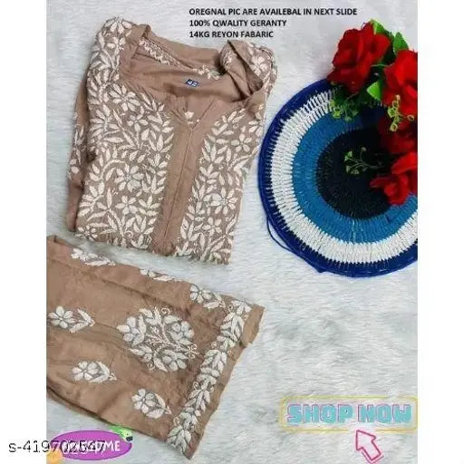 Rayon Chikankari Embroidered Kurti Plazzo set, three-quarter sleeves, Indian craftwork on display