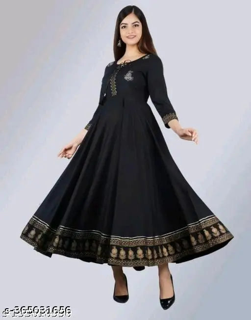 Black rayon three-quarter sleeve top with printed combo, black border on sleeves. S - 36in bust size available