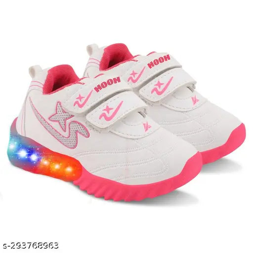 Light pink cellulose and rubber shoes for girls (Ladkiyo ke jute). Breathable cotton blend material, adjustable hook & loop closure, LED light design, ideal for night outings. Comfortable sole, perfect for exploration and fun