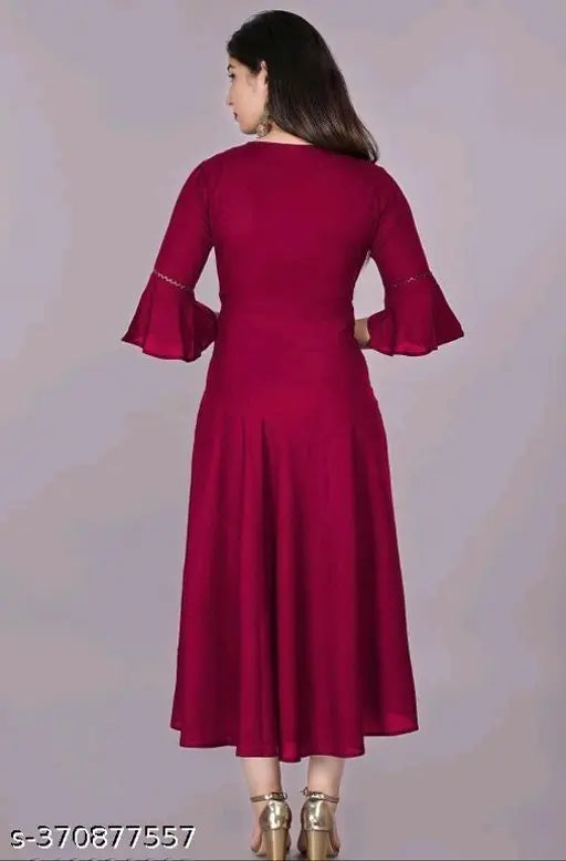 Maroon rayon solid flared kurti with three-quarter sleeves, suitable for casual and formal occasions. Hand wash or machine wash care. One readymade kurti per packet. Size based on two inches more than body measurement. Color may slightly vary due to lighting sources
