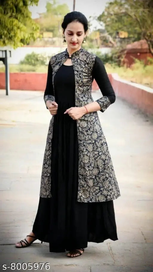 Solid black rayon women's kurti with three-quarter sleeves, perfect for casual wear or parties. Indian origin." (123 characters)
