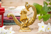 Gold oxide metal sitting baby Ganesh idol statue on peacock with book, 15x7x15.5 cm for puja and vastu showpiece