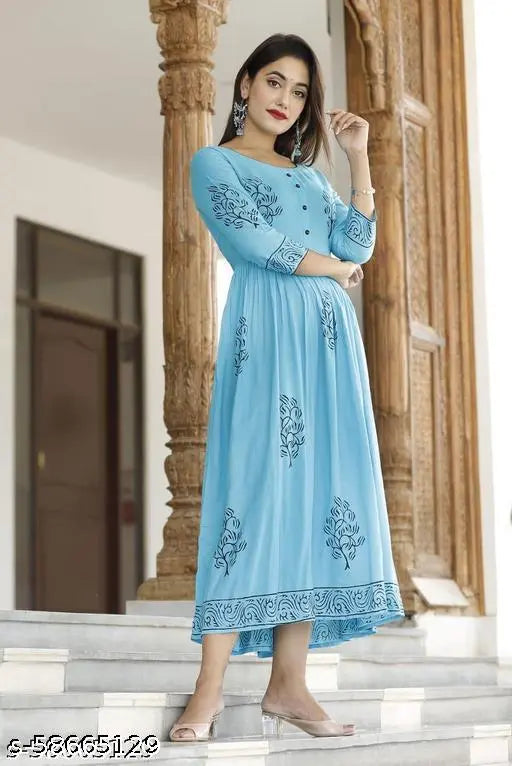 Hand block printed sky blue rayon Anarkali kurta with three-quarter sleeves, vibrant floral print design on a traditional Indian outfit