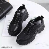 Black synthetic sneaker, TPR sole, lace-up fastening on a sports background