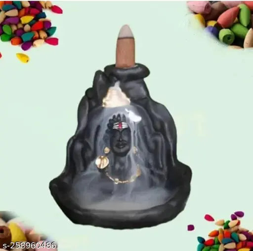Black polyresin Shiv incense burner, features Adiyogi baba Bholenath, creates smokey waterfall illusion with 21 cones. Handcrafted Indian decor showpiece, ideal for home