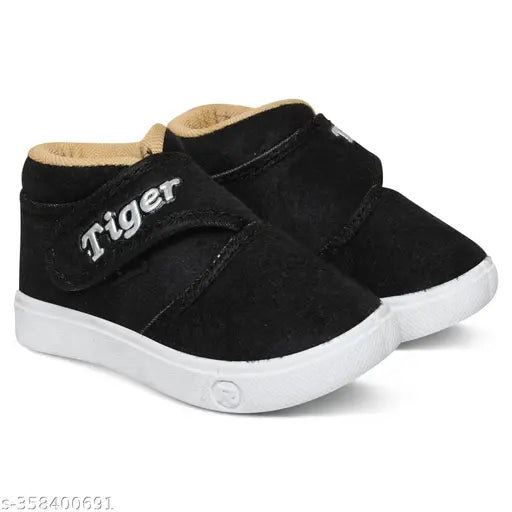 Black velvet kids shoes for both boys and girls with Velcro fastening and rubber soles