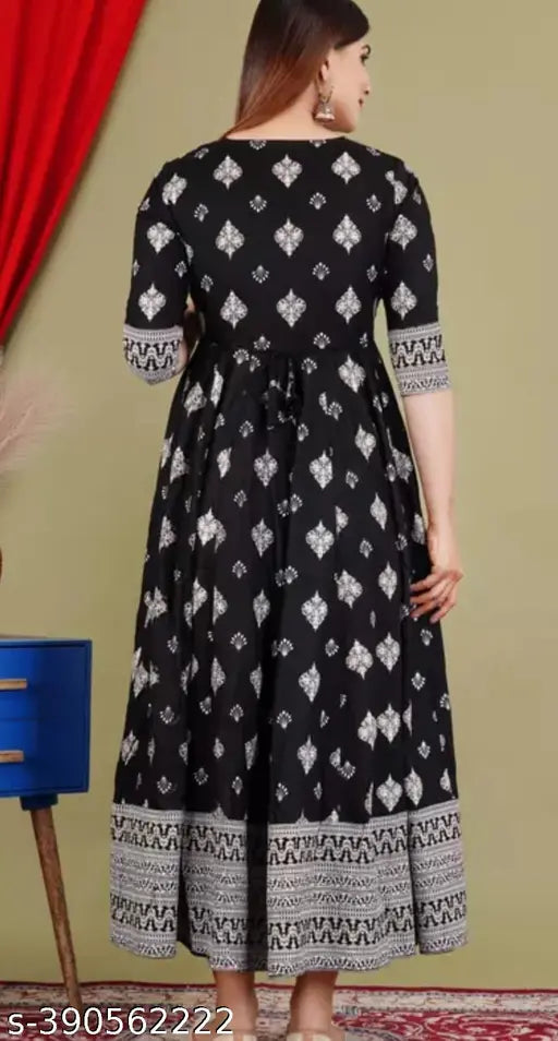 Black rayon three-quarter sleeve blouse with printed combo, model wearing size S (36in bust, 44in length)