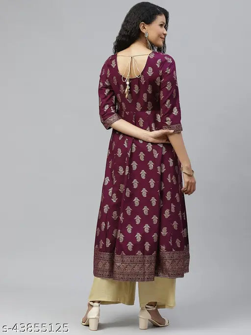 Cotton anarkali kurta with three-quarter sleeves, printed combo, and side zipper. Indian traditional anarkali dress in golden print featuring round neck and gold latkan detail on backside. XS bust size 34 in, XL bust size 42 in