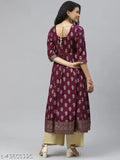 Cotton anarkali kurta with three-quarter sleeves, printed combo, and side zipper. Indian traditional anarkali dress in golden print featuring round neck and gold latkan detail on backside. XS bust size 34 in, XL bust size 42 in