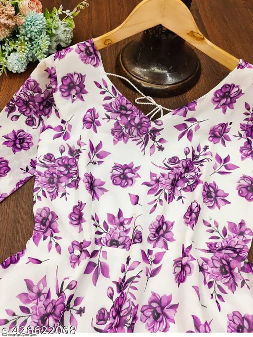 White silk gorgetee gown with printed net dupatta, three-quarter sleeves. Women's fashion evening wear with various sizes available