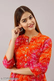 Women's rayon flared printed orange kurti with three-quarter sleeves, size S-XXL. India origin
