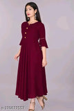 Maroon rayon flared kurti, three-quarter sleeves for women's casual or formal wear. Single-color design, hand wash/machine washable. Size declaration: choose two inches larger than body measurement