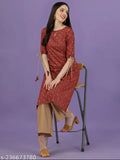 Maroon rayon kurta and palazzo set with all-over gold print, keyhole neck, three-quarter sleeves, tie-up and tassels. Indian ethnic wear for women