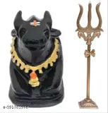 Black poly resin Nandi statue with Shiva's brass Trishul and Damru, ideal for temple puja or home decor